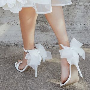 LULU white bow shoes. Great for bridal events! Worn once.